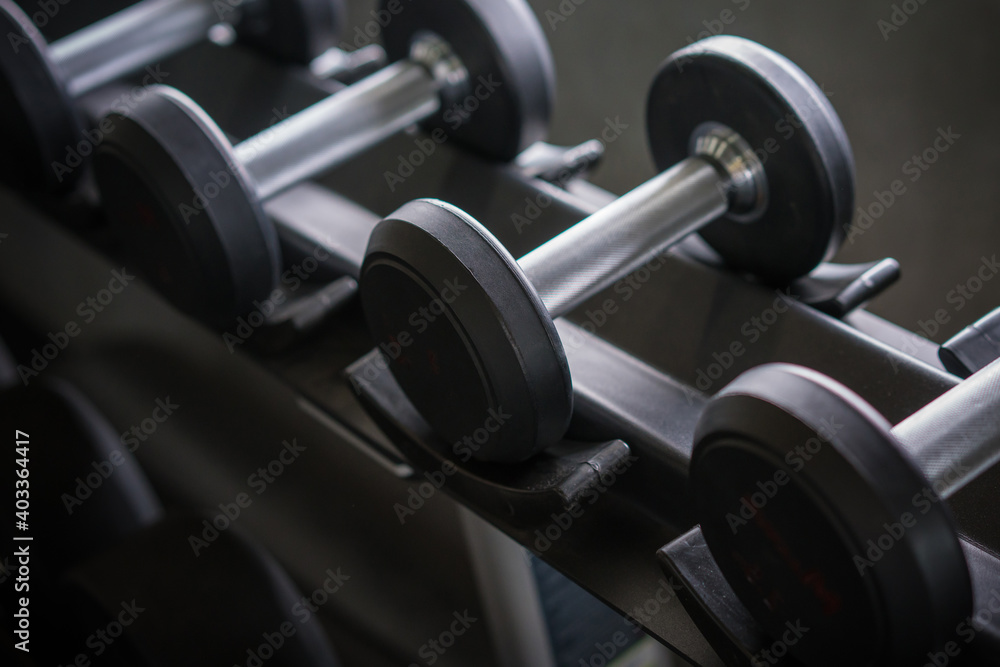 dumbbells in the gym at sports club for exercise and Bodybuilding dumbbells in the gym at sports club for exercise and Bodybuilding
