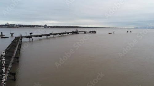 Drone view Tranmere oil terminal Birkenhead coastal petrochemical harbour distribution overfly orbit over pipeline photo