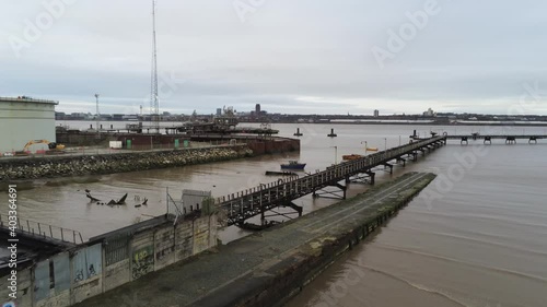 Drone view Tranmere oil terminal Birkenhead coastal petrochemical harbour distribution Merseyside push in fast photo