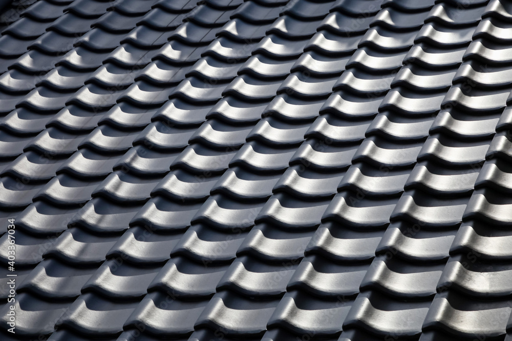 Fototapeta premium silhouette of roof tile home building for background.