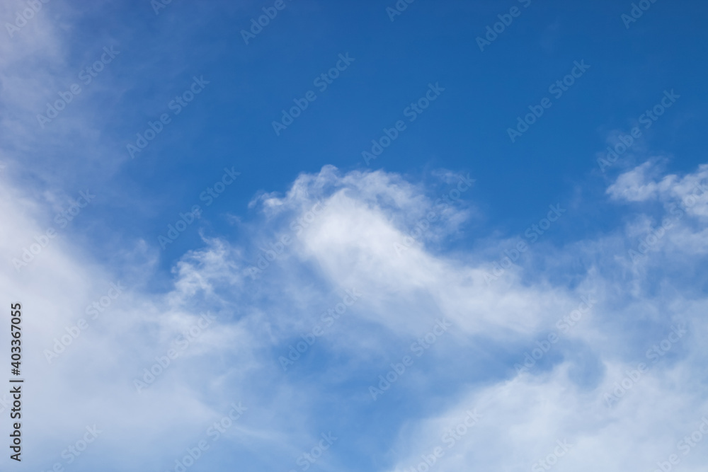 nature background., white clouds over blue sky soft focus.