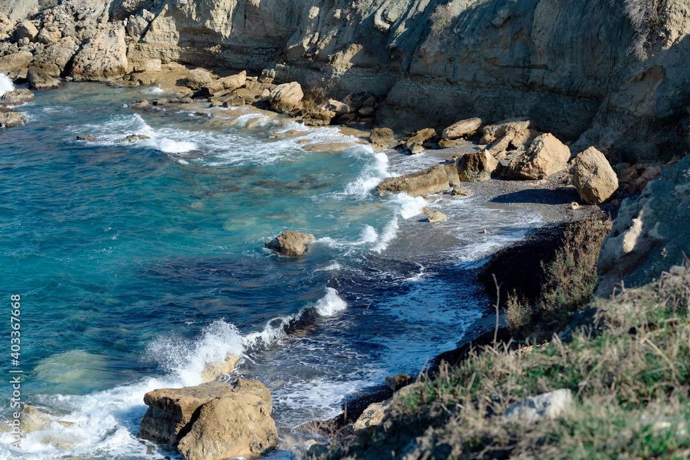 Sweeping view of the Cyprus coast, sea stacks and ocean waves.