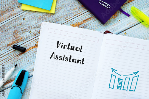 Financial concept about Virtual Assistant with sign on the sheet. photo