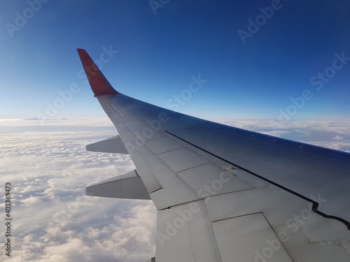 Wing aircraft in the blue sky