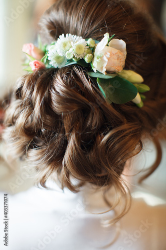 Wedding hairstyles.Hairdressing.The bride. Beautiful hairstyle with curls. Wedding.