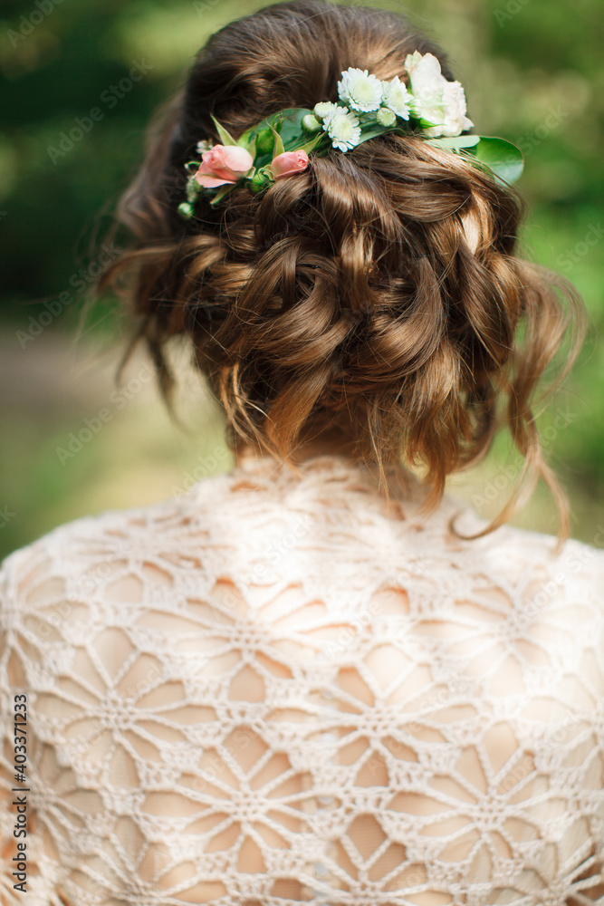 Wedding hairstyles.Hairdressing.The bride. Beautiful hairstyle with curls. Wedding.