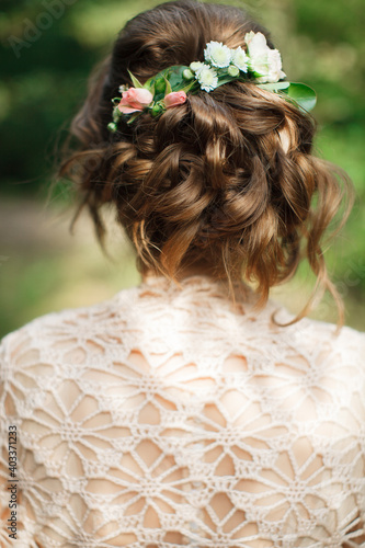 Wedding hairstyles.Hairdressing.The bride. Beautiful hairstyle with curls. Wedding.