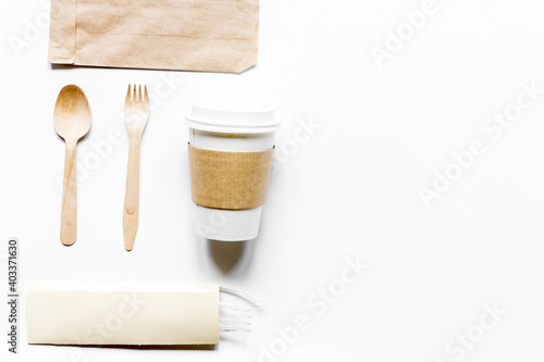 breakfast take away with paper bags on white table background top view mock up