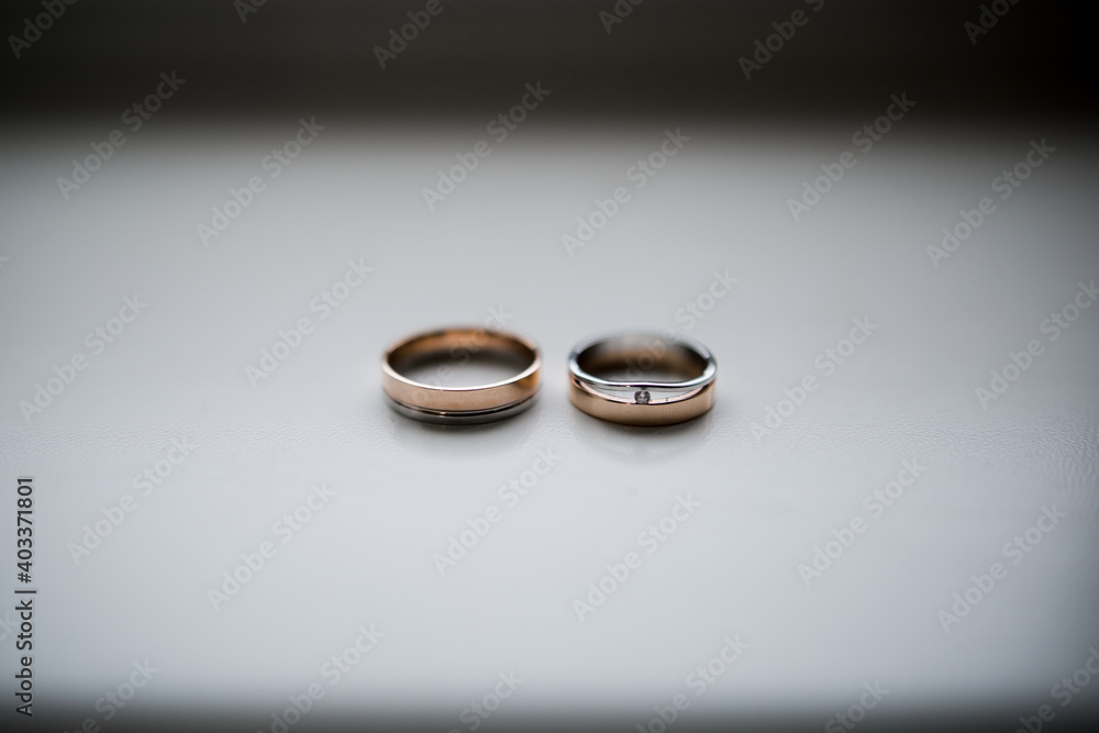 wedding rings of the bride and groom lie on the table wedding rings of the bride and groom lie on the table