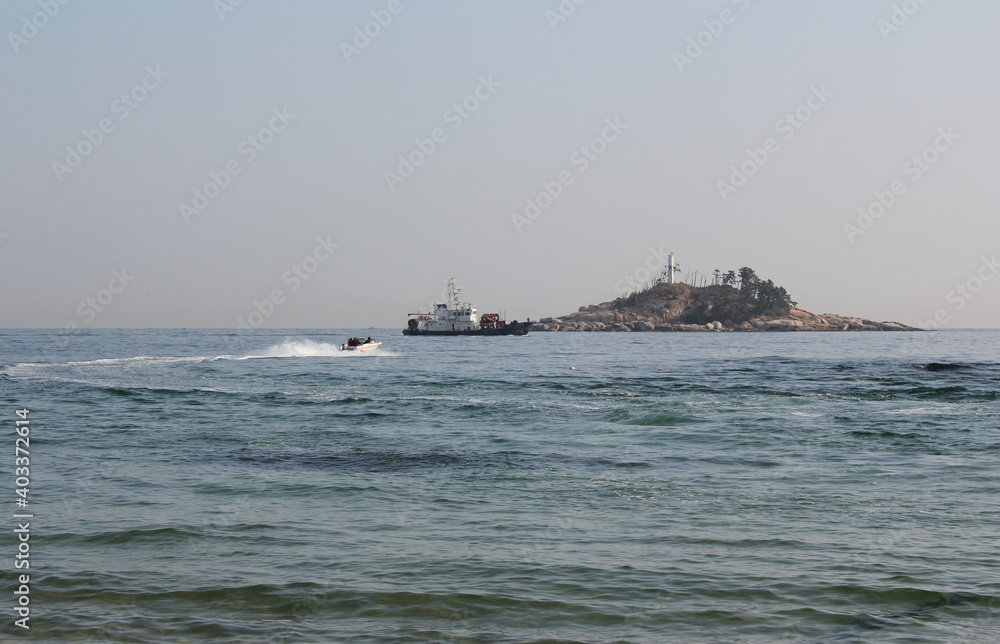 Motor boats and Police ship at sea in summer 