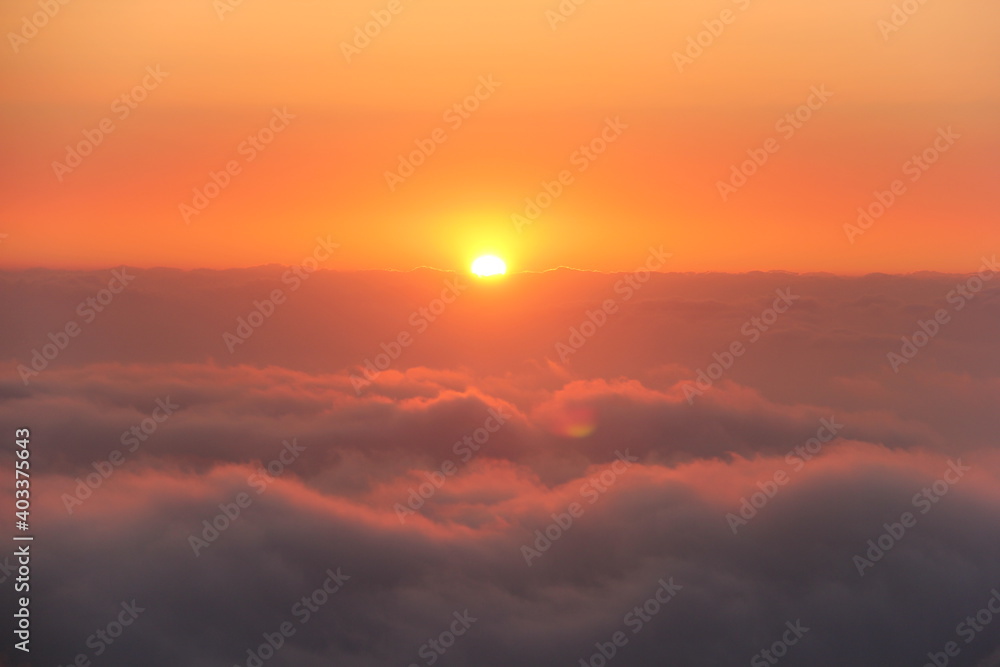 sunrise over the dramatic clounds. Beautiful Skyscape full sun over orange clounds. Cyprus mauntains sunset.