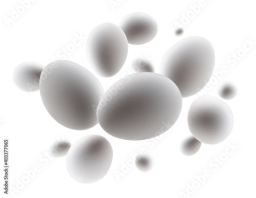 White chicken eggs levitate on a white background