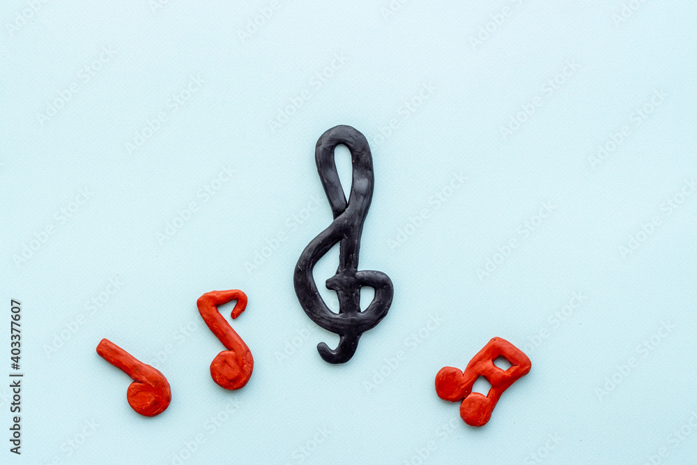 Fototapeta premium Abstract music notes made of rubber, top view. Music background