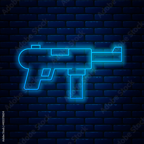 Glowing neon line Submachine gun M3, Grease gun icon isolated on brick wall background. Vector.