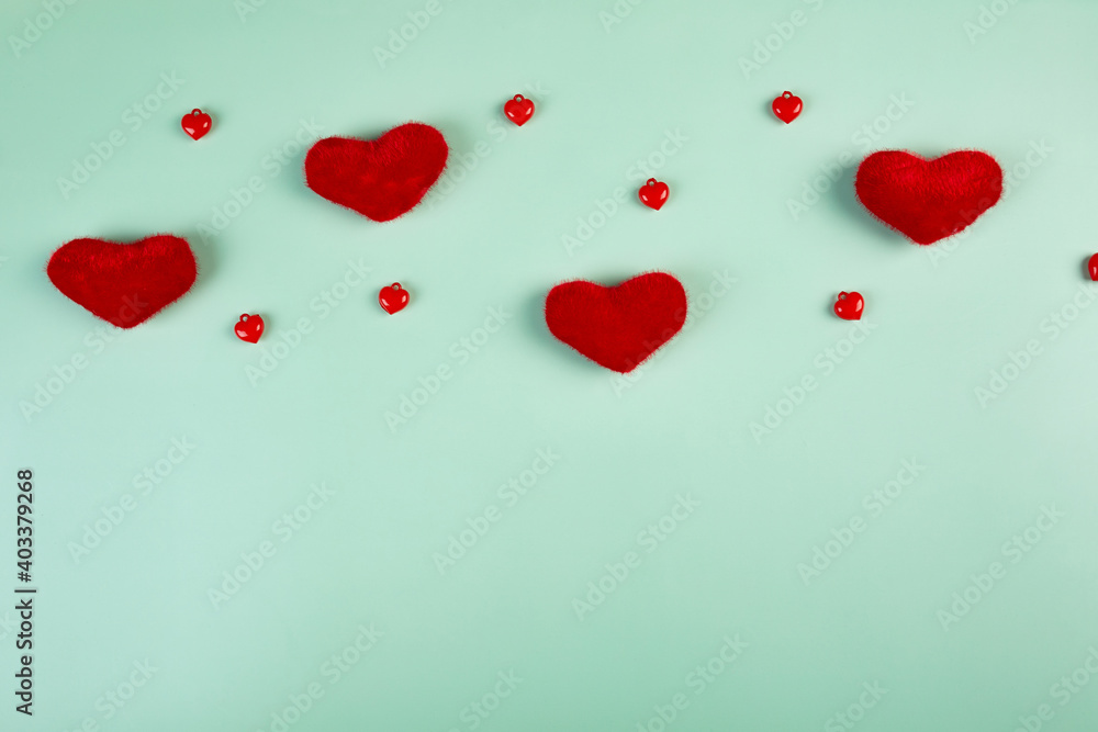 Flat lay of Valentines day greeting card with hearts on blue paper background
