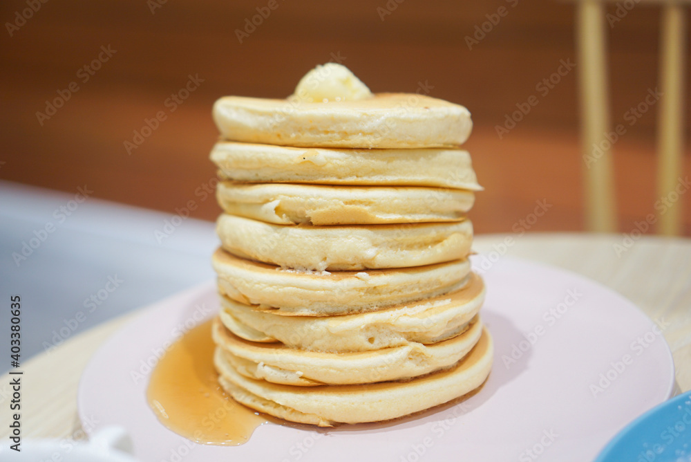 Original fluffy pancake stacks with butter and maple syrup. Center. Original fluffy pancake stacks with butter and maple syrup. Center.
