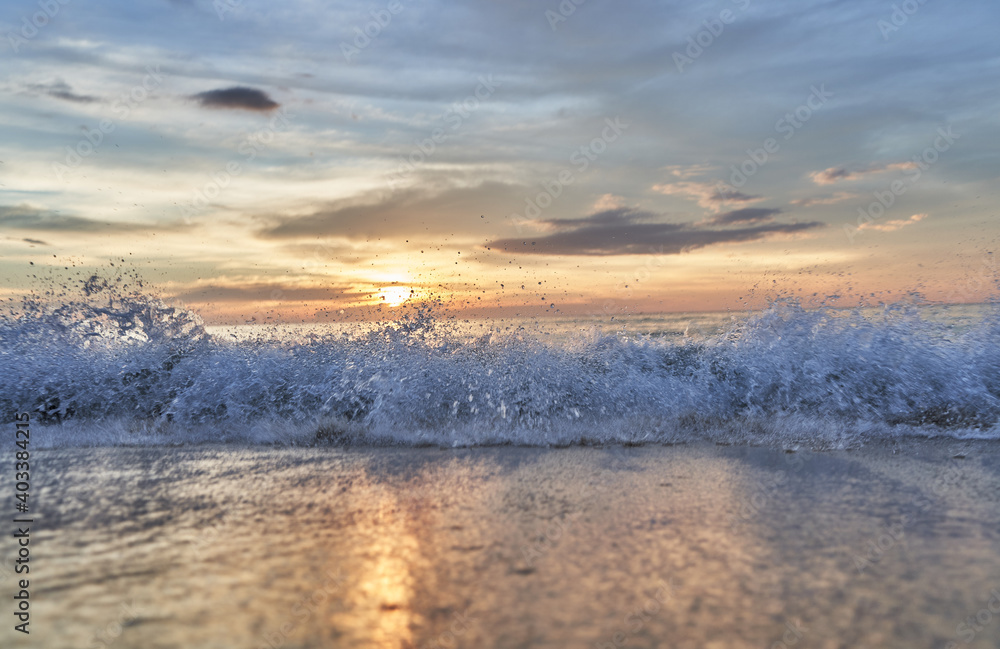 Waves Splashing on the Sunset Beach. 
