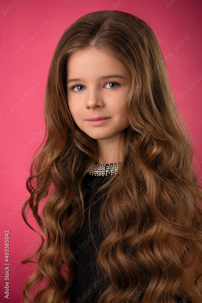 portrait of a beautiful child girl with long beautiful hair in a hairstyle portrait of a beautiful child girl with long beautiful hair in a hairstyle