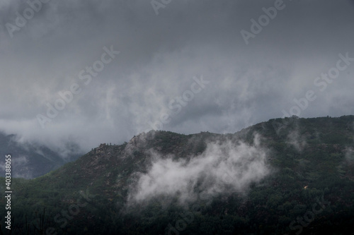 clouds lifting up from the mountains © Ana