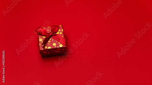 Flat lay image colorful box gift present bright design isolated on red background. Concept for lover in Valentine's Day, Birthday, New Year or Christmas. Empty copy space 