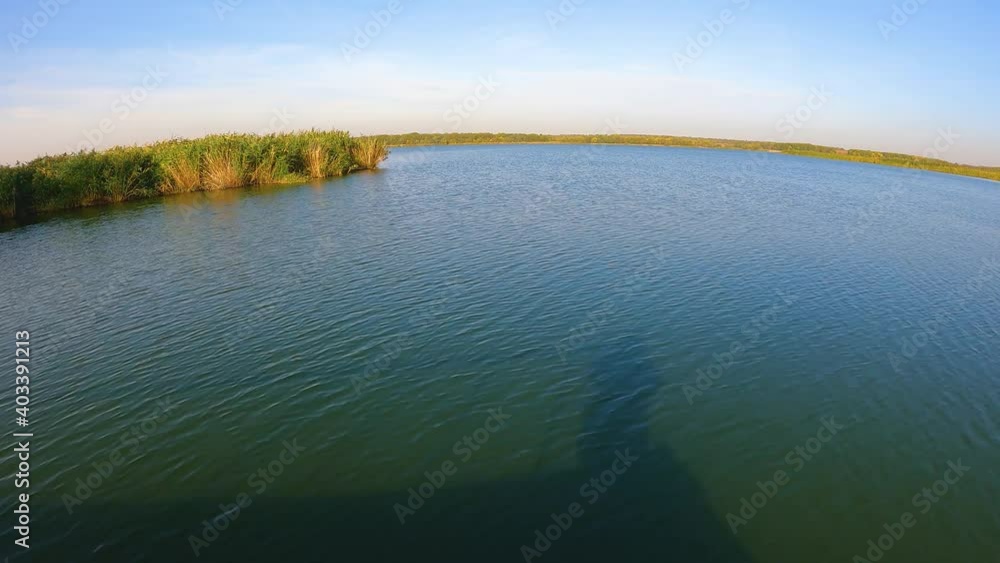 traveling wave along the river light summer day. time warp traveling wave along the river light summer day. time warp