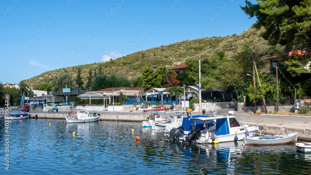 Moored boats near a village in Greece