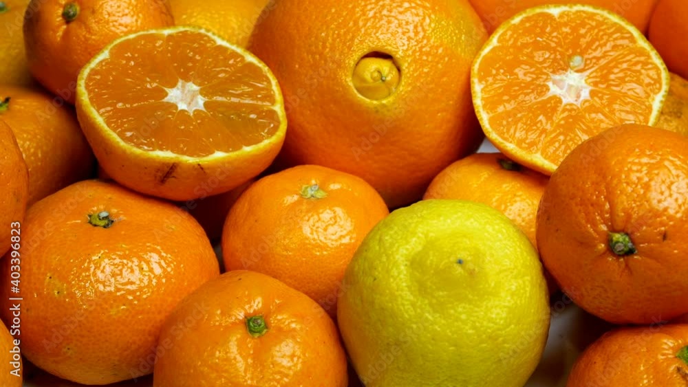 Heap of citrus fruits that contain a lot of vitamin C. Tangerines