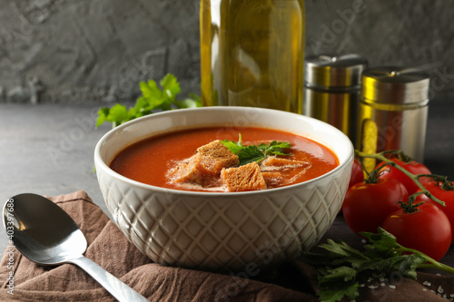 Obraz na plátně Concept of tasty food with tomato soup on dark wooden background