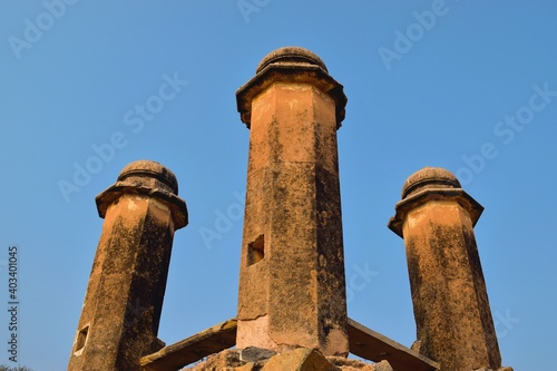 Old ruined historic pillars of a vintage Indian well