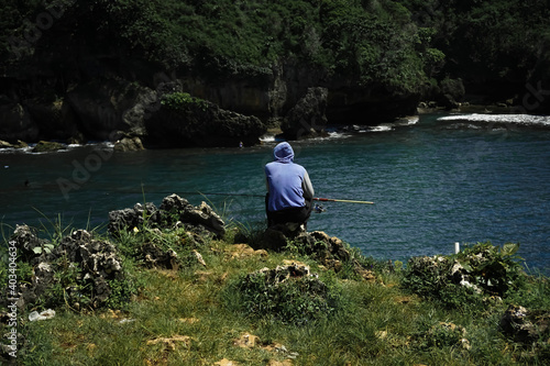 man fishing in the seaside