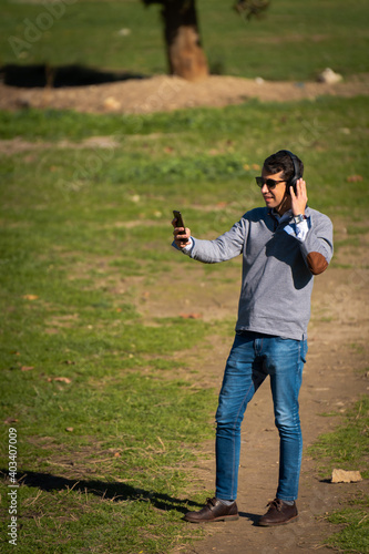Young man making a video call from his mobile phone