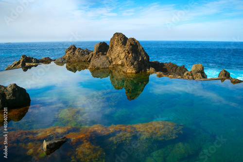 Ocean bathes lava pools Mad...