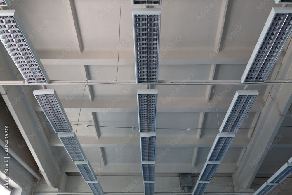 Fototapeta premium Industrial mercury lamps in rectangular lamps in an old building.