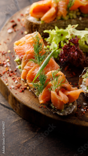 Fried bread with salmon with lettuce leaves