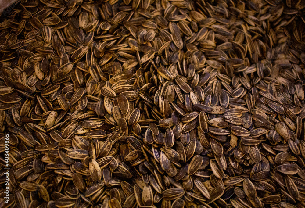 background image of multiple sunflower seeds on the shop for sale