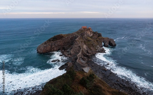 Aerial panorama of Gaztelugatxe islet rock castle hermitage chapel footbridge island Bermeo Basque Country Spain photo