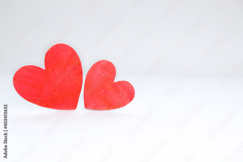 Fototapeta premium Background of two wooden hearts with copy space