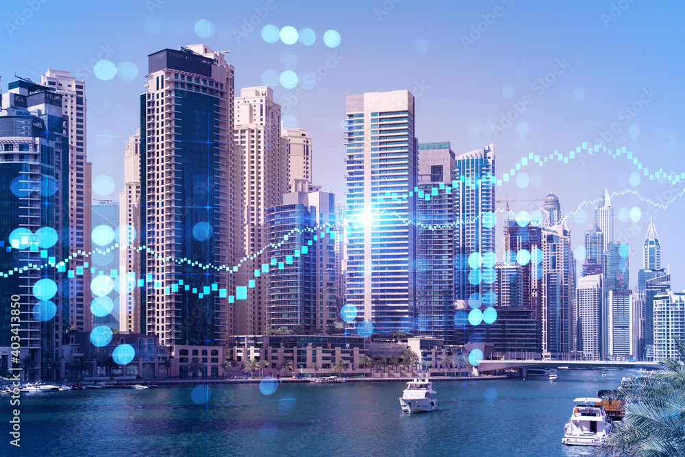 Fototapeta premium Skyscrapers of Dubai business downtown. International hub of trading and financial services of Western Asia. FOREX graph and chart concept. Double exposure. Dubai Canal waterfront.