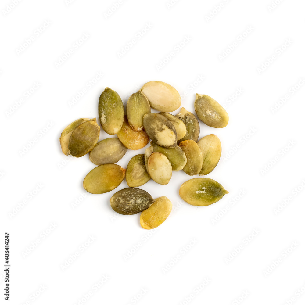 Obraz premium Pumpkin seeds pile isolated on white background top view