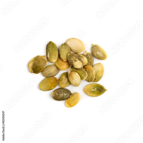 Pumpkin seeds pile isolated on white background top view