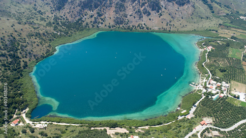 Beautiful landscape of the island from a bird's-eye view. Pure blue lake, mountains and olive tree plantations.