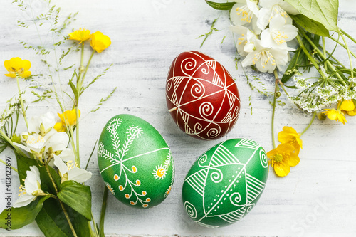 Red and green Easter pysanka eggs with flowers