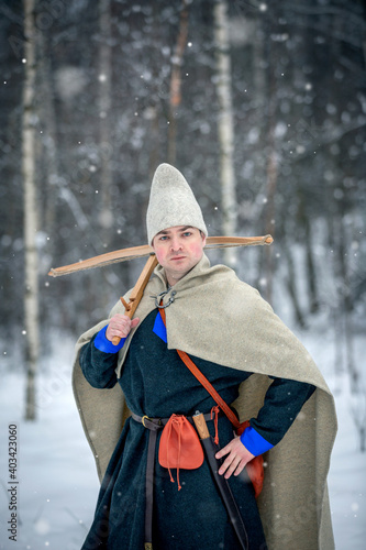 Young man in medieval European costume, historical reenactment 