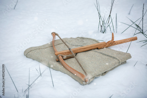Stampa su tela Wooden medieval European crossbow in the snow
