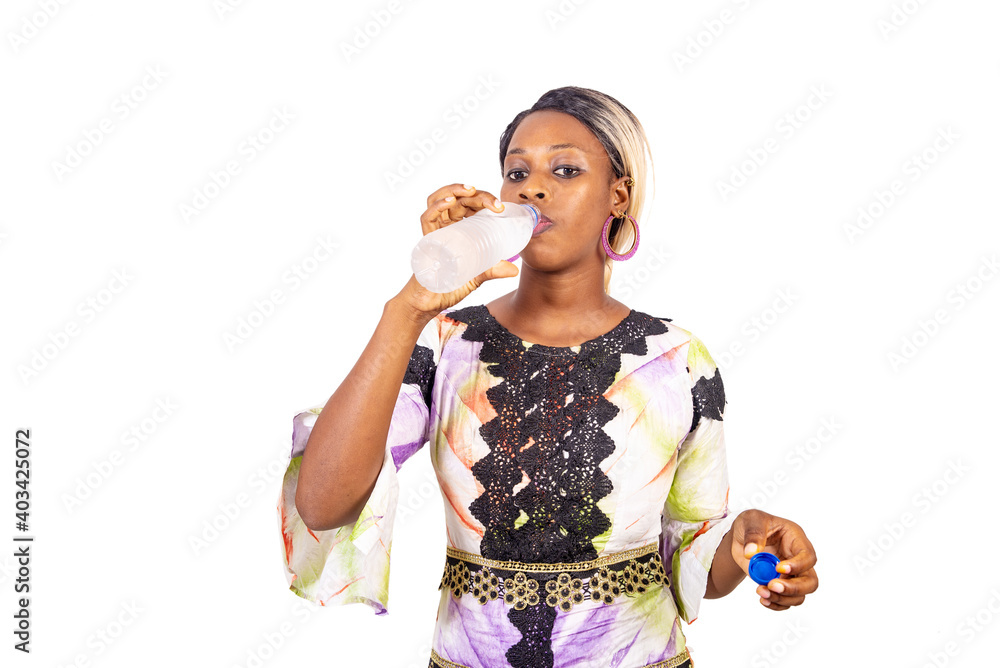 beautiful young african woman with a bottle of water. beautiful young african woman with a bottle of water.