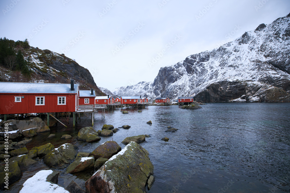 Lofoten Islands. Beautiful landscape. Red houses and mountains.
