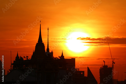 Silhouette of the Chedi Phu Khao Thong (Golden Mount) of Wat Saket Temple at Dawn, the Iconic Landmark of Bangkok, Thailand © jobi_pro