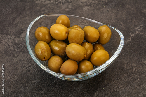 Green pickled olives in the bowl