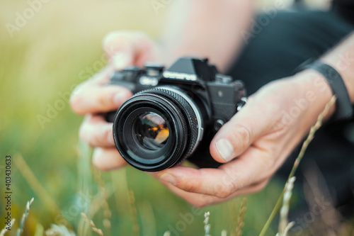 Man holding mirror les camera in the nature © malajscy