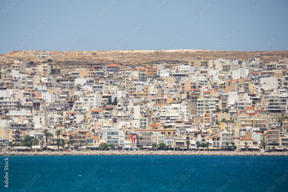 view of a mountain city next to sea